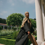 Minimalist linen abaya with a relaxed shape and spacious, hidden pockets.