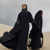 Opulent abaya featuring flared cuffs and soft embellishments throughout
