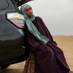 Textured tweed abaya with a generous fit and elevated everyday style