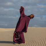 Elegant kaftan with soft, continuous lines and inspiration drawn from the pomegranate’s meaning
