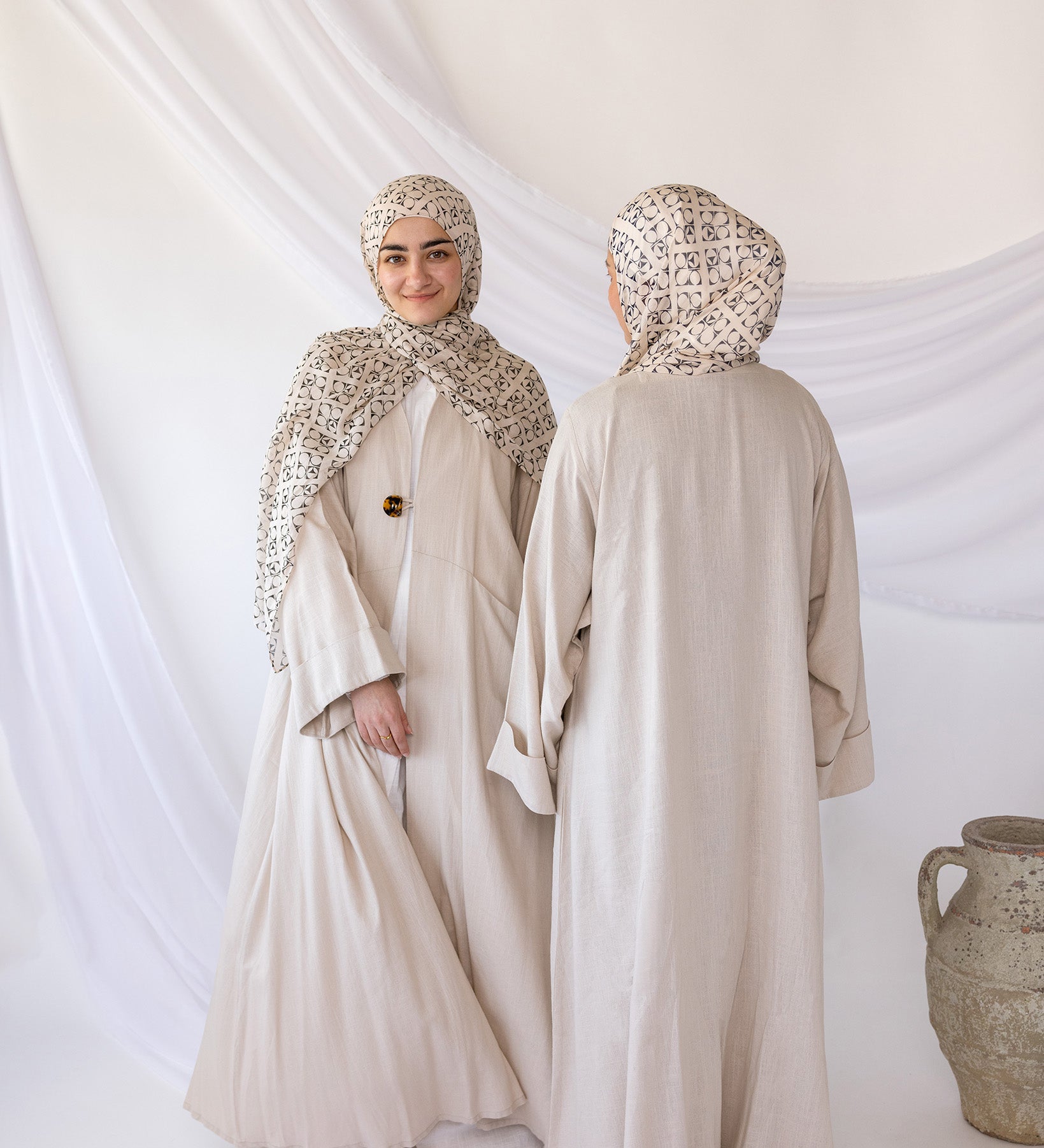 Breathable linen abaya designed with practical side pockets and a clean, classic cut.