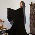 Elegant abaya featuring fine pleats and lightweight movement for easy styling.