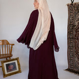 Soft pleated abaya with fluid drape, perfect for dressing up or wearing simply.