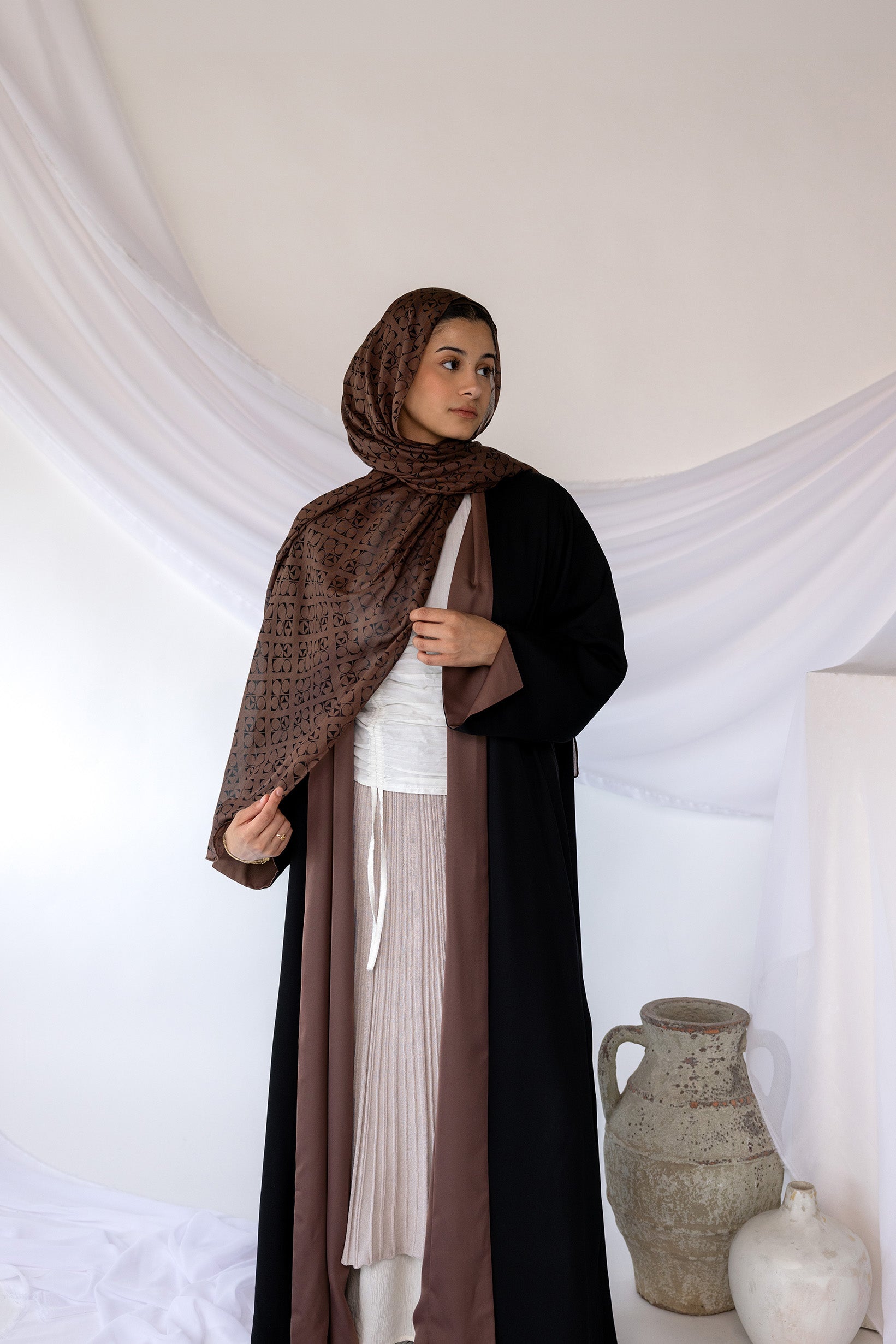Two-in-one abaya designed for effortless outfit changes with a timeless cut.