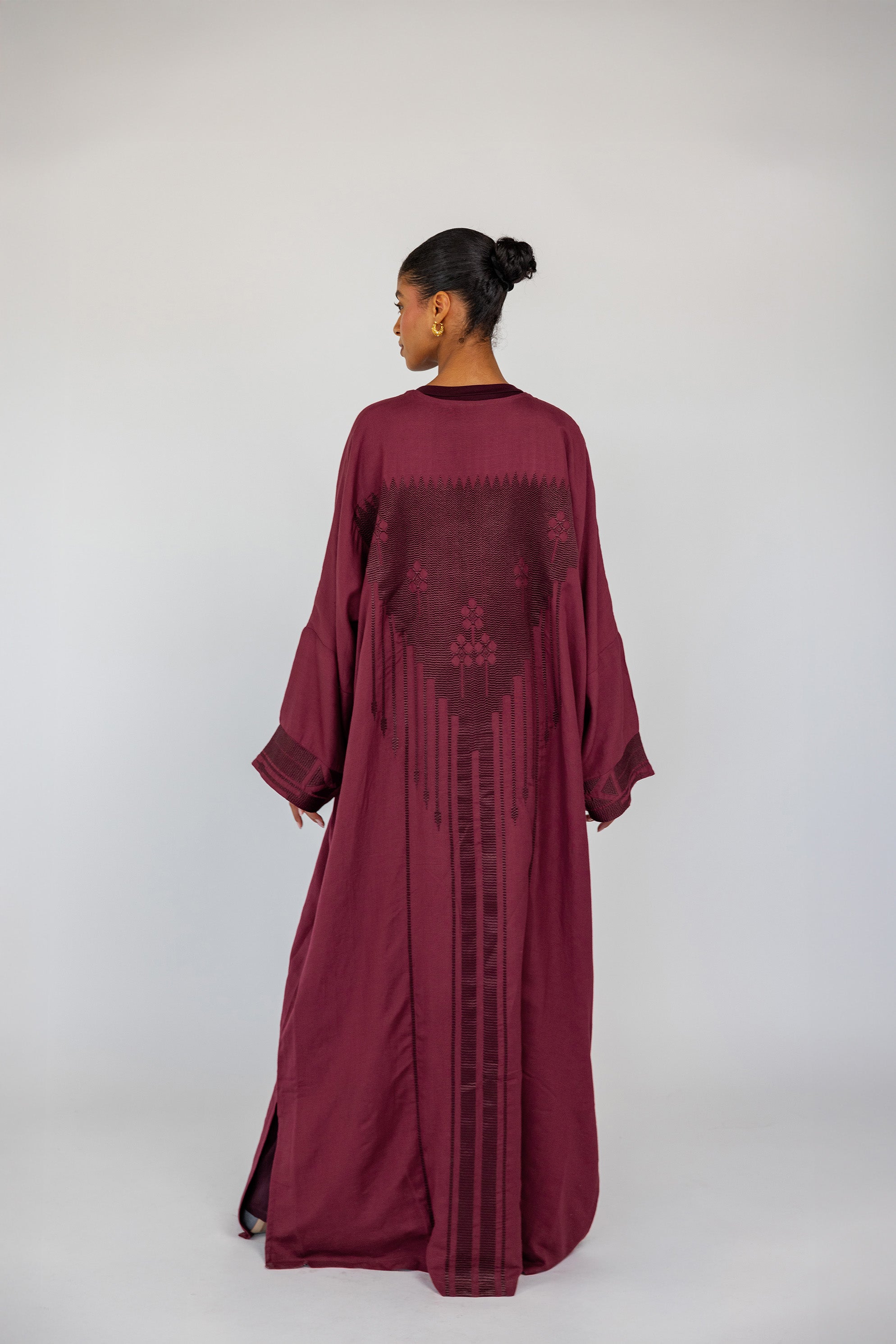 Tradition-inspired abaya with back detailing that reflects Syrian textile artistry