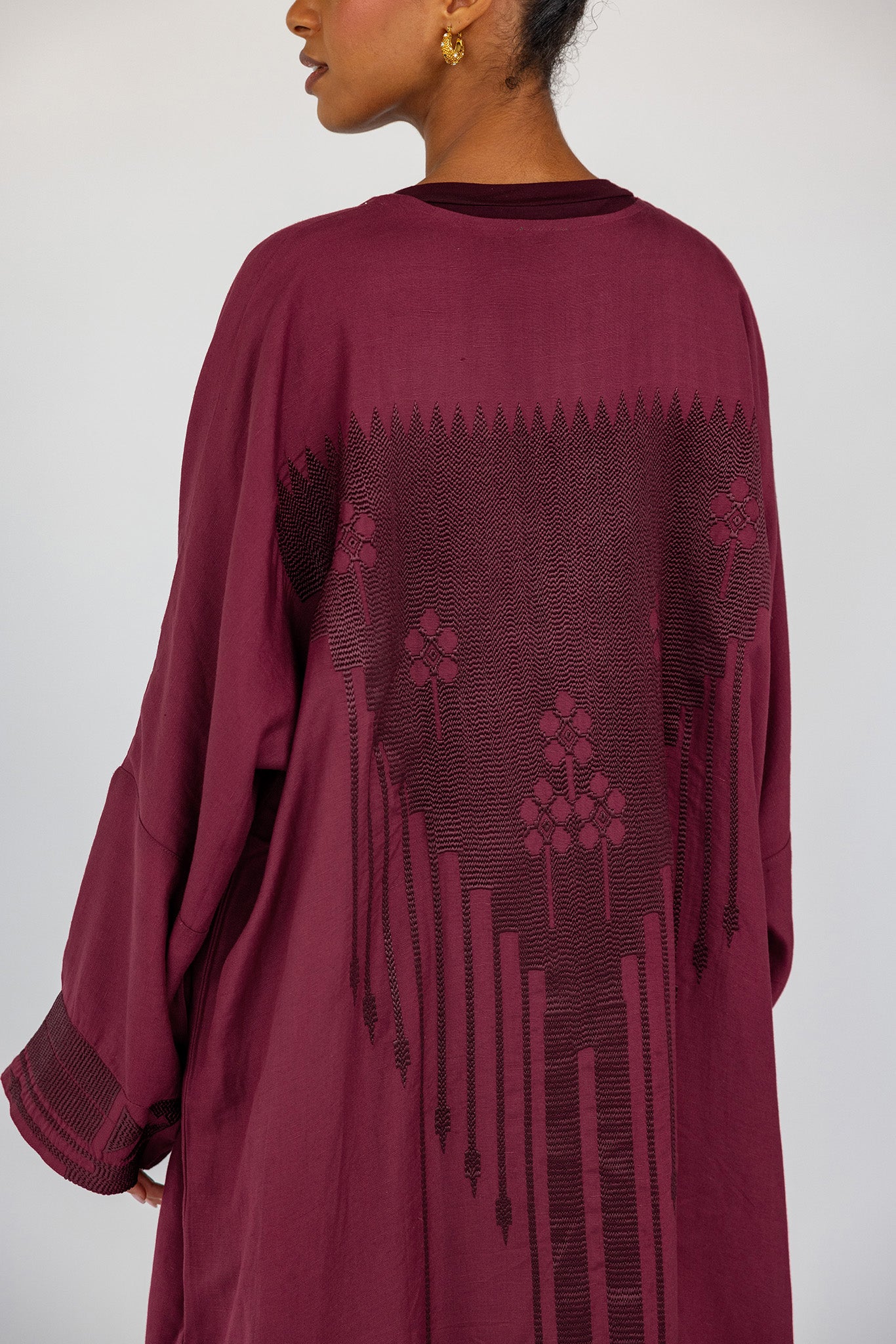 Everyday abaya crafted in a breathable linen blend with elegant embroidery at the back