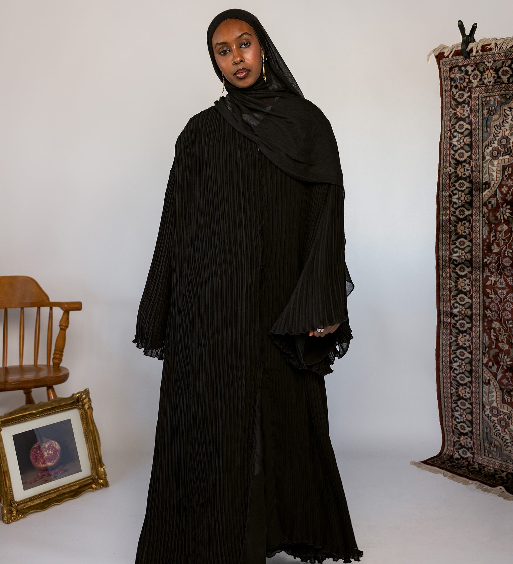 Full-length pleated abaya crafted from soft fabric with all-over flowing pleats.