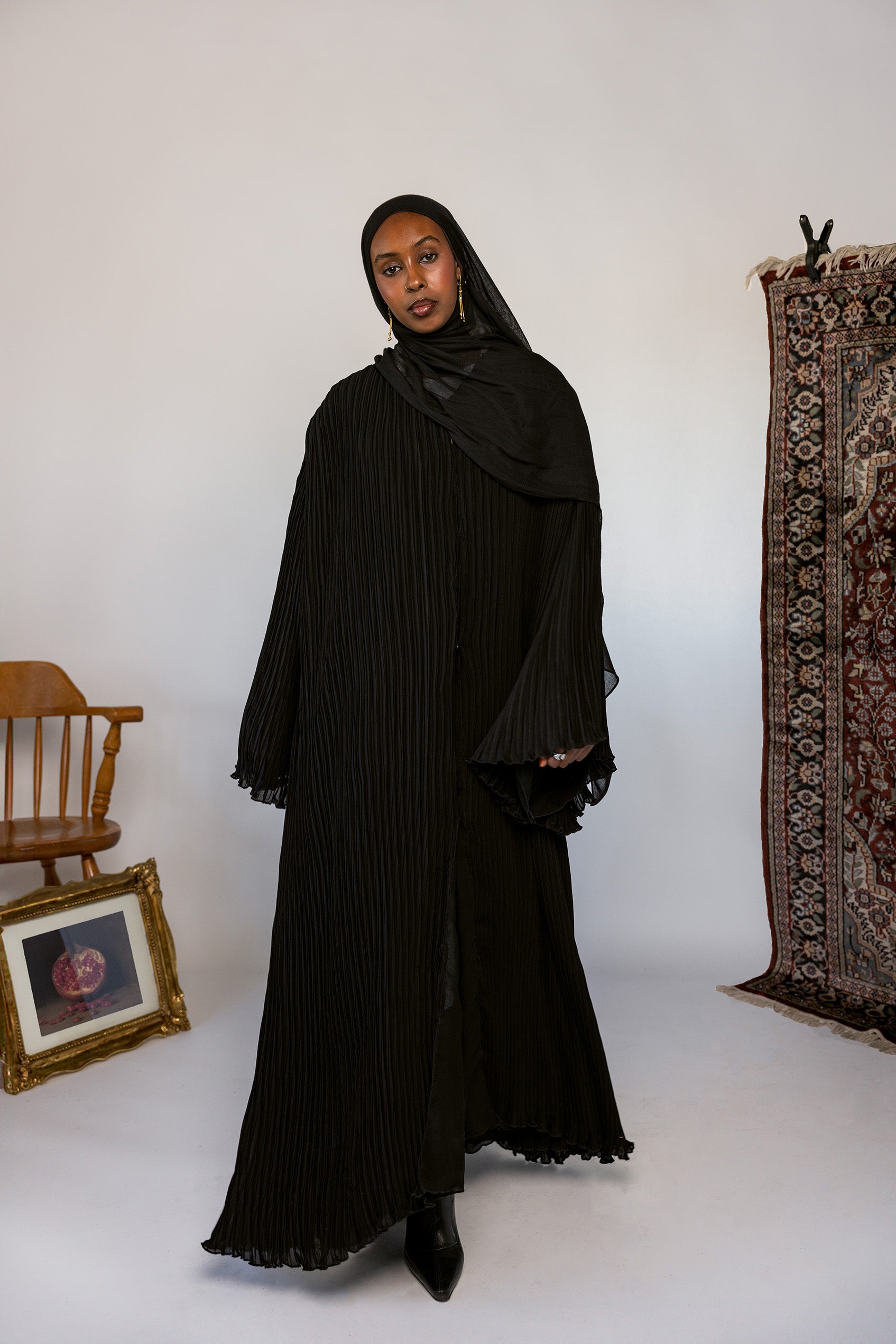 Full-length pleated abaya crafted from soft fabric with all-over flowing pleats.