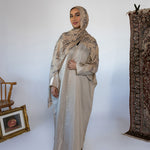 Lightweight abaya with a soft sheen and flowing drape for a radiant finish.