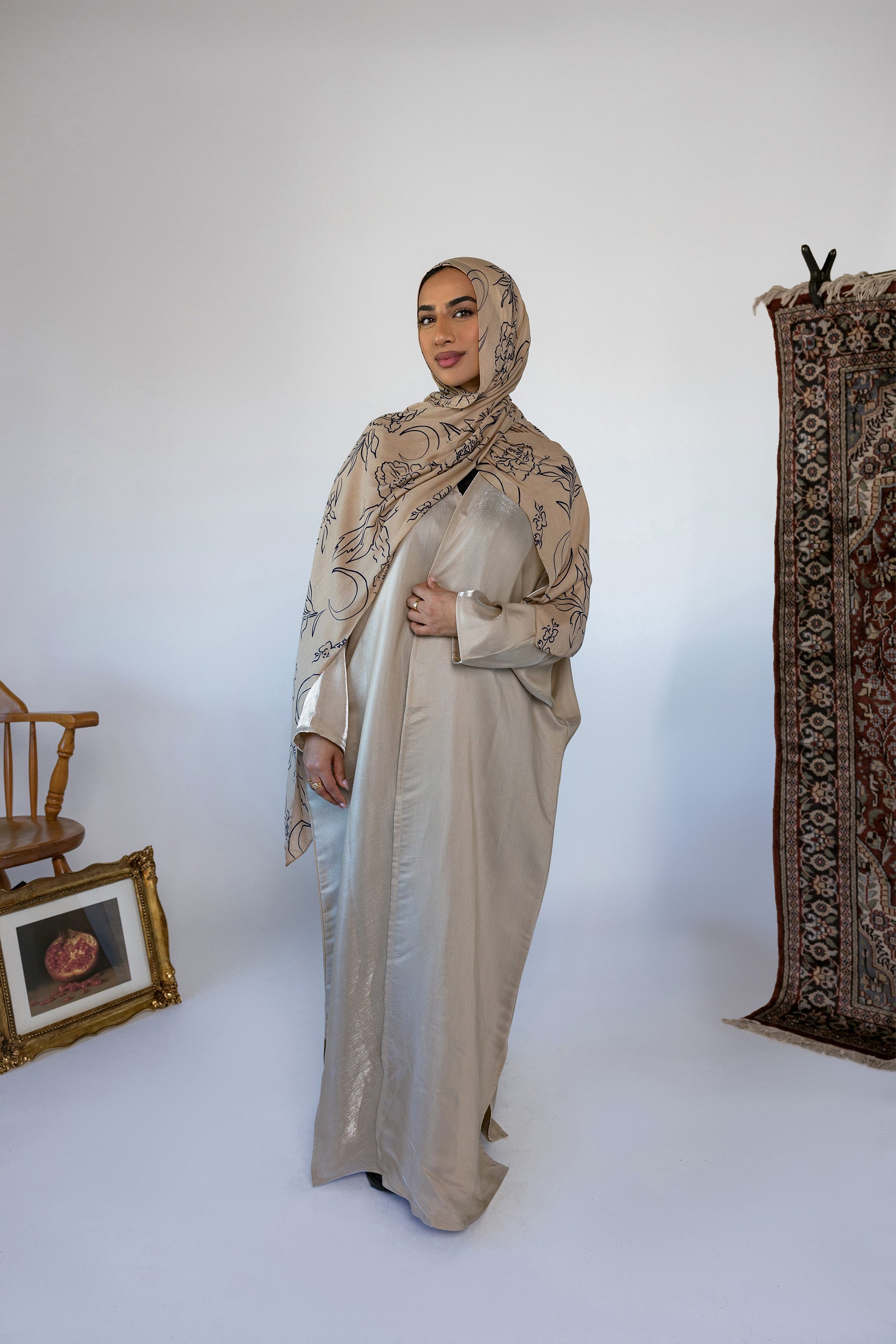 Lightweight abaya with a soft sheen and flowing drape for a radiant finish.