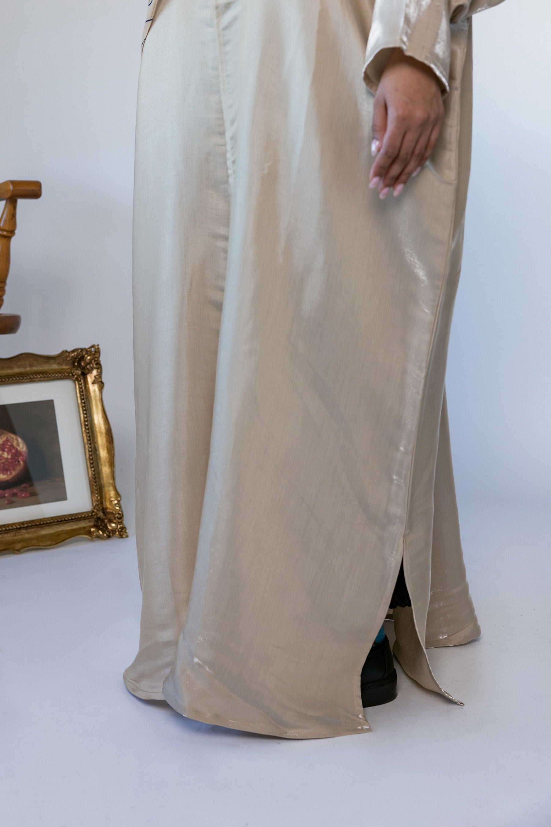 Full-length abaya with a smooth finish and a slight sheen for a polished look.