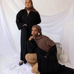 Lightweight abaya crafted from breathable linen, finished with functional pockets.