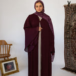 Flowy pleated abaya designed with soft fabric and full-length movement.