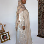 Glowing abaya with delicate texture and breathable fabric, perfect for evening wear.