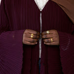 All-over pleated abaya crafted for comfort, elegance, and everyday layering.
