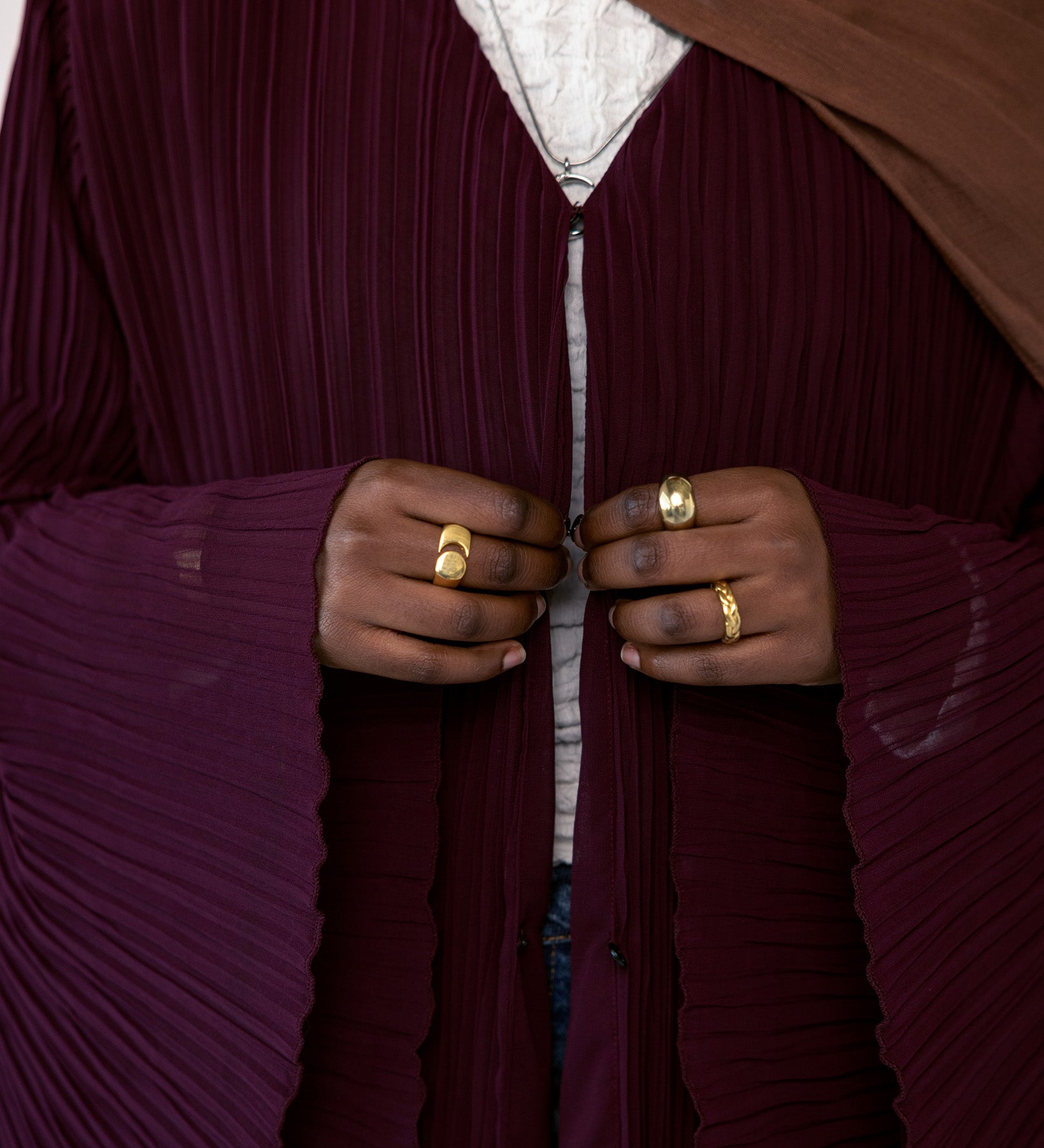 All-over pleated abaya crafted for comfort, elegance, and everyday layering.