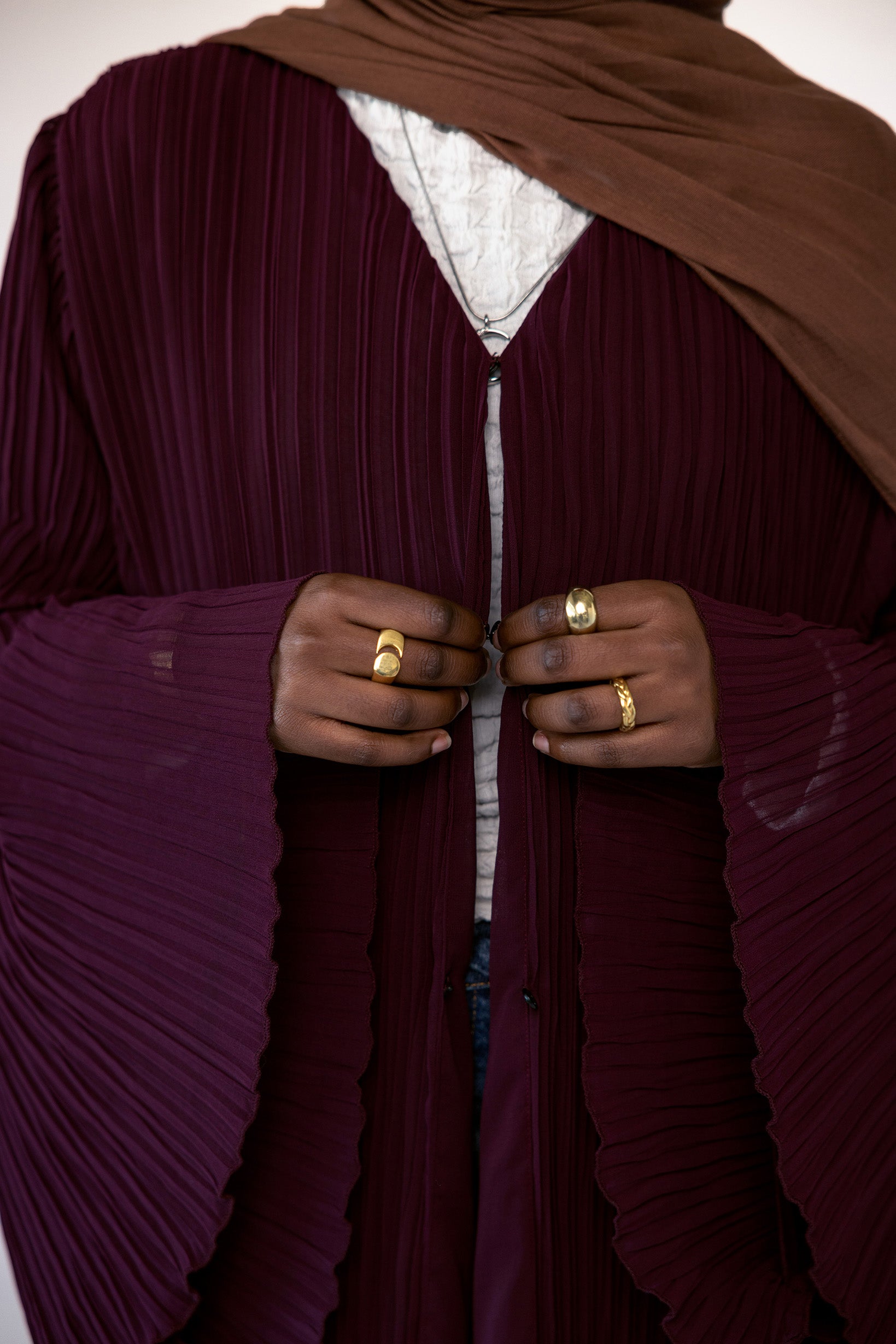 All-over pleated abaya crafted for comfort, elegance, and everyday layering.