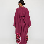 Occasion-ready kaftan with rich drape and subtle nods to traditional symbolism