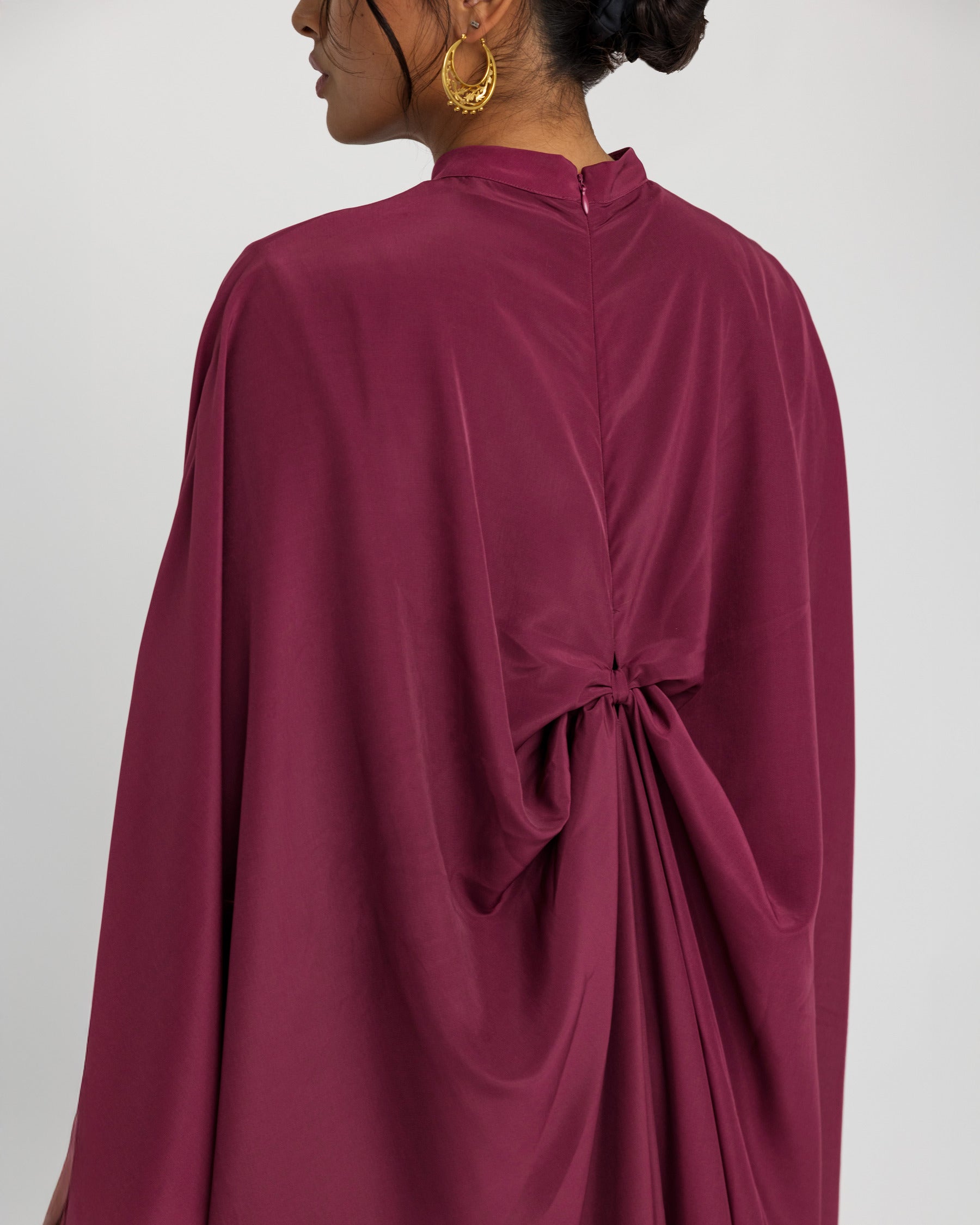 Draped formal kaftan designed to celebrate heritage through movement and style