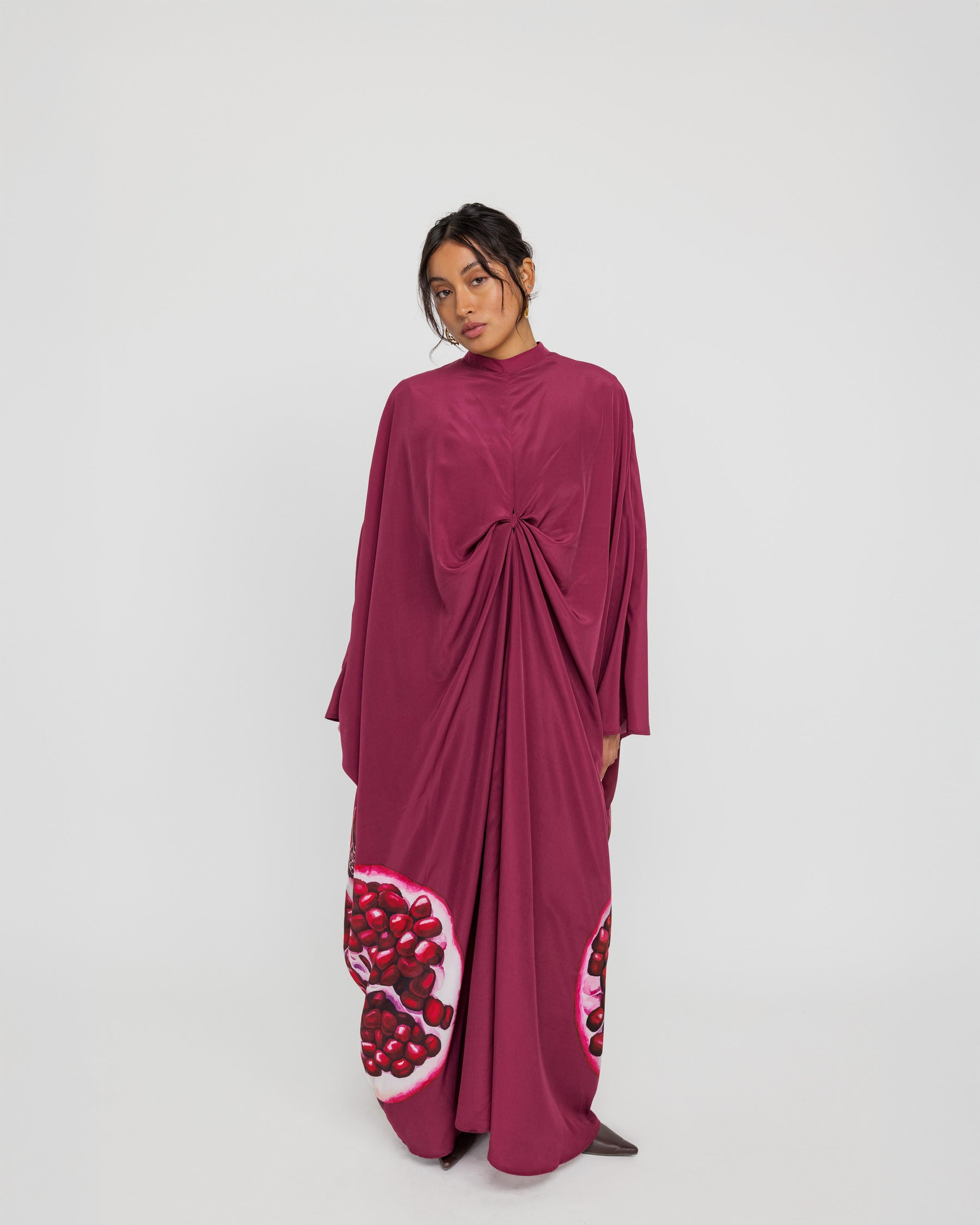 Statement kaftan with elegant draping and a heritage-inspired design for special occasions
