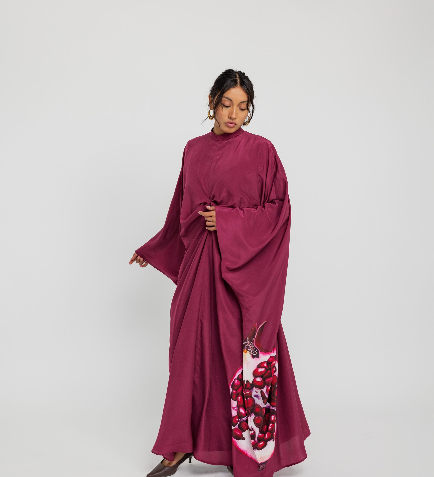 Modest kaftan with a fluid shape and soft structure, evoking timeless beauty and abundance