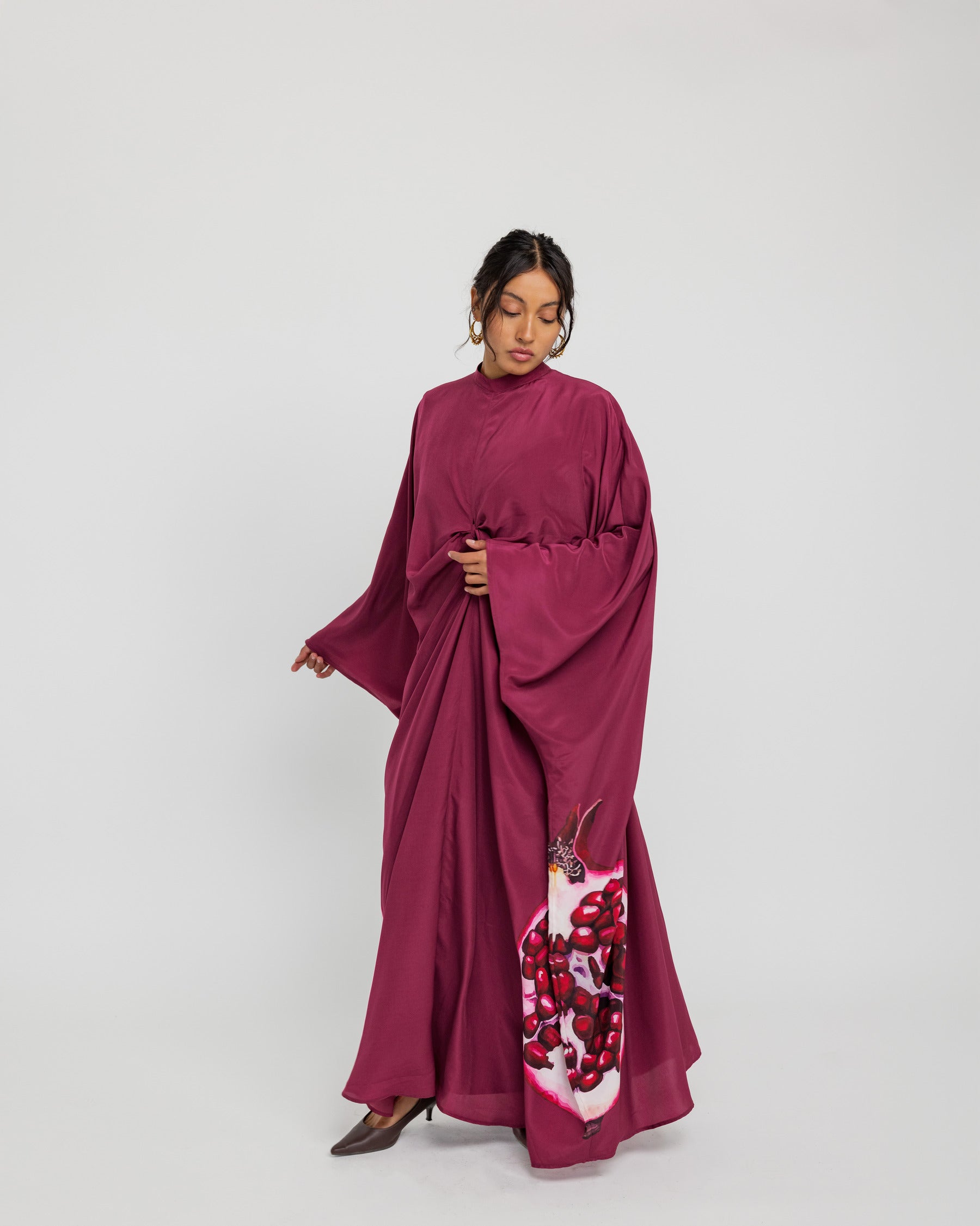 Modest kaftan with a fluid shape and soft structure, evoking timeless beauty and abundance