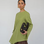 Airy top with a loose shape and simple front tie, designed for comfort and movement.