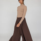 Black palazzo pants with wide legs and relaxed structure, perfect for everyday wear