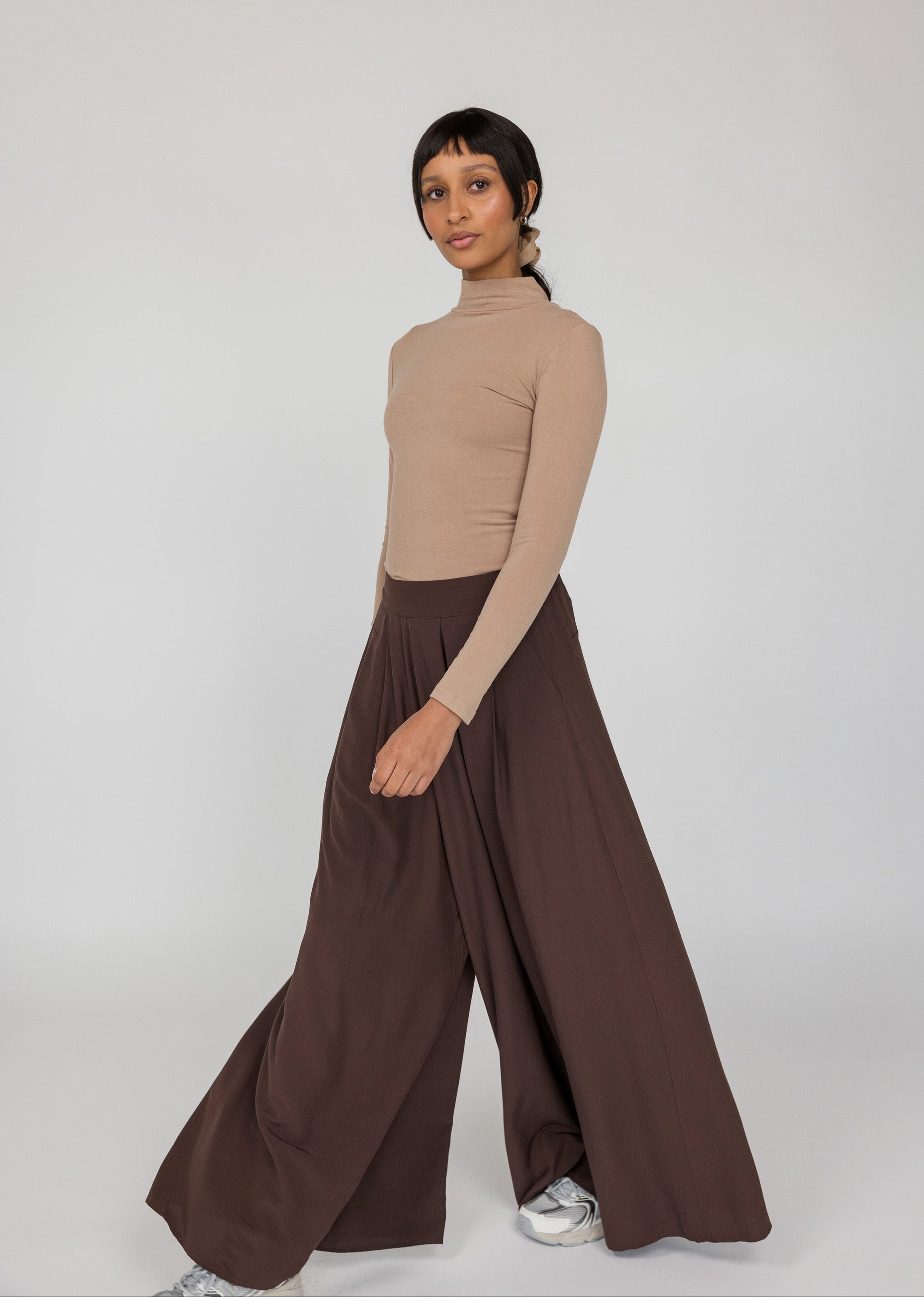 Black palazzo pants with wide legs and relaxed structure, perfect for everyday wear
