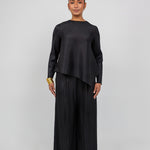 Relaxed-fit pleated top with a modest cut and timeless, structured design.