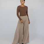 Wide-leg pleated pants with a soft drape and relaxed, modest fit.