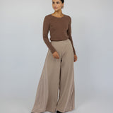 Wide-leg pleated pants with a soft drape and relaxed, modest fit.
