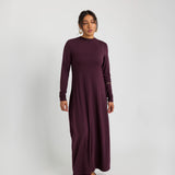 Soft knit under dress designed for layering, with a smooth and flexible fit.