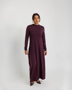 Soft knit under dress designed for layering, with a smooth and flexible fit.