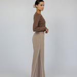 Full-length pants with front pleats and wide legs, designed for comfort