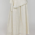 Full-length cream skirt with woven texture, designed for modest and easy styling.