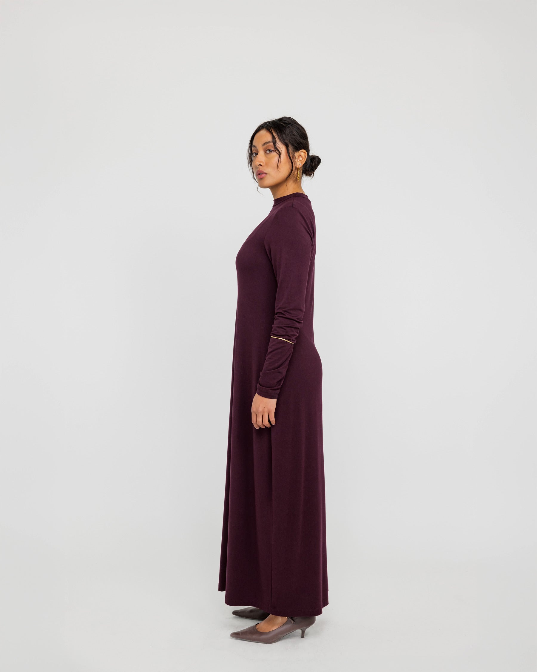 Base layer knit dress with a close fit, ideal for styling under sheer or open pieces.