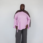 Top with long sleeves and adjustable front tie, made for a laid-back yet polished look