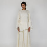 Breathable cream top with floral texture and front tie, made to wear alone or with a matching skirt.