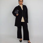 High-waisted flare pants with checkered knit texture and ankle-length finish.