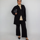 High-waisted flare pants with checkered knit texture and ankle-length finish.
