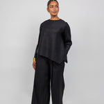 VELA pleated top with gentle texture and flow, designed for movement and ease