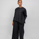 VELA pleated top with gentle texture and flow, designed for movement and ease