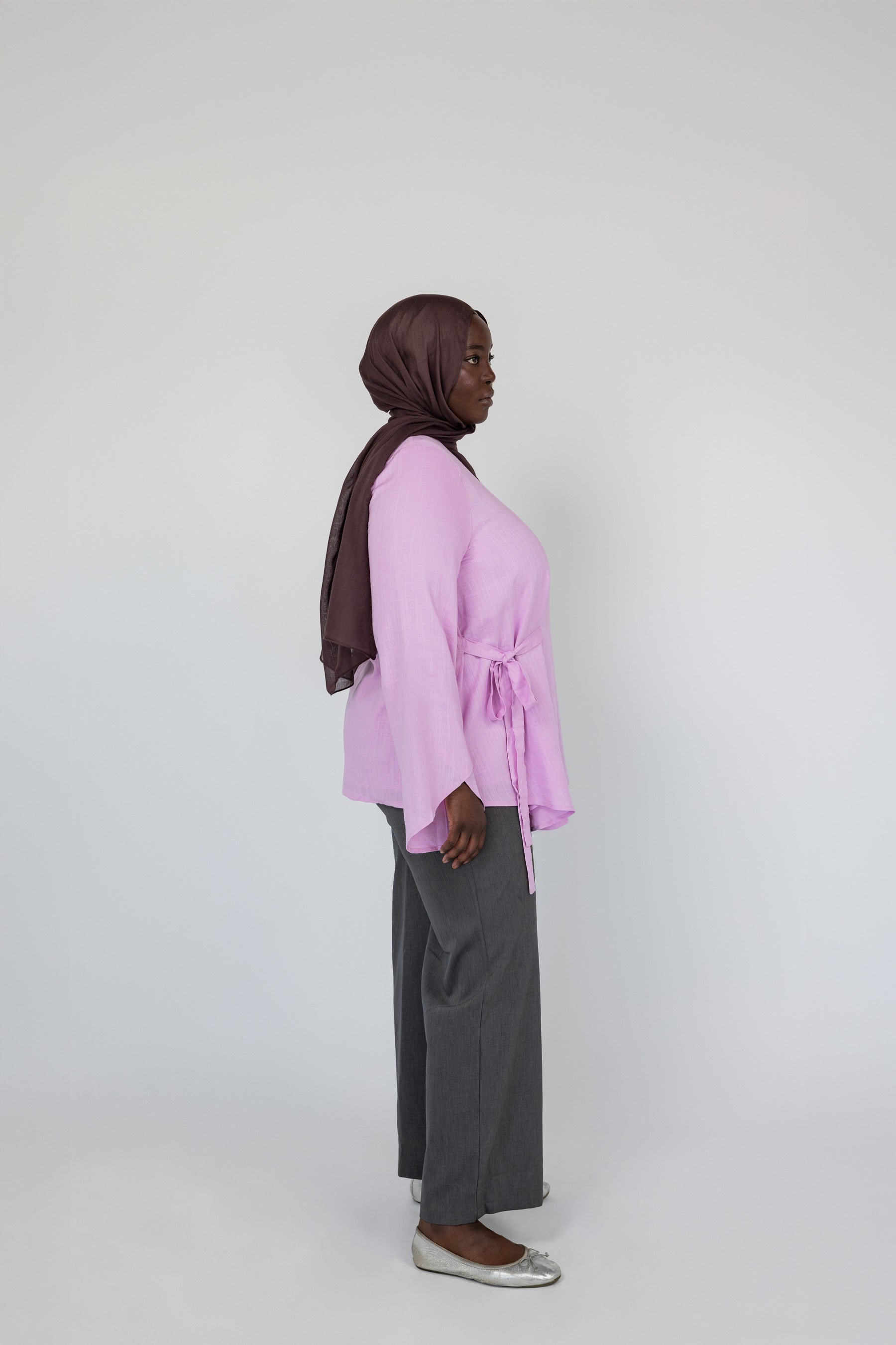 Woven top with front-tie accent and airy cut, designed for effortless modest wear.