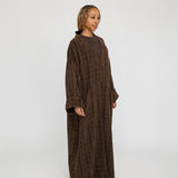 Everyday abaya crafted in structured tweed, offering depth and quiet elegance