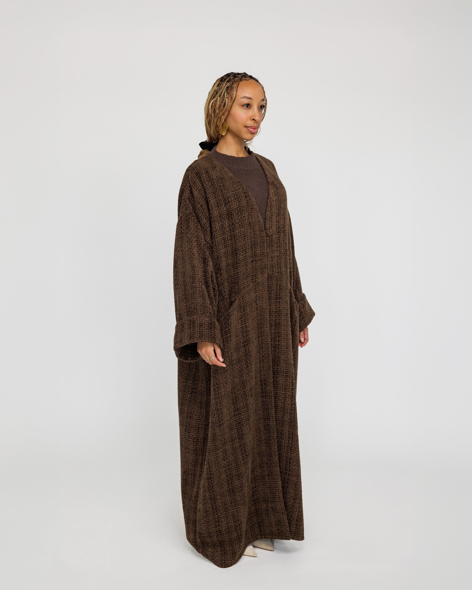 Everyday abaya crafted in structured tweed, offering depth and quiet elegance