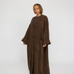 Oversized tweed abaya with textured fabric and a softly structured drape