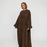 Oversized tweed abaya with textured fabric and a softly structured drape
