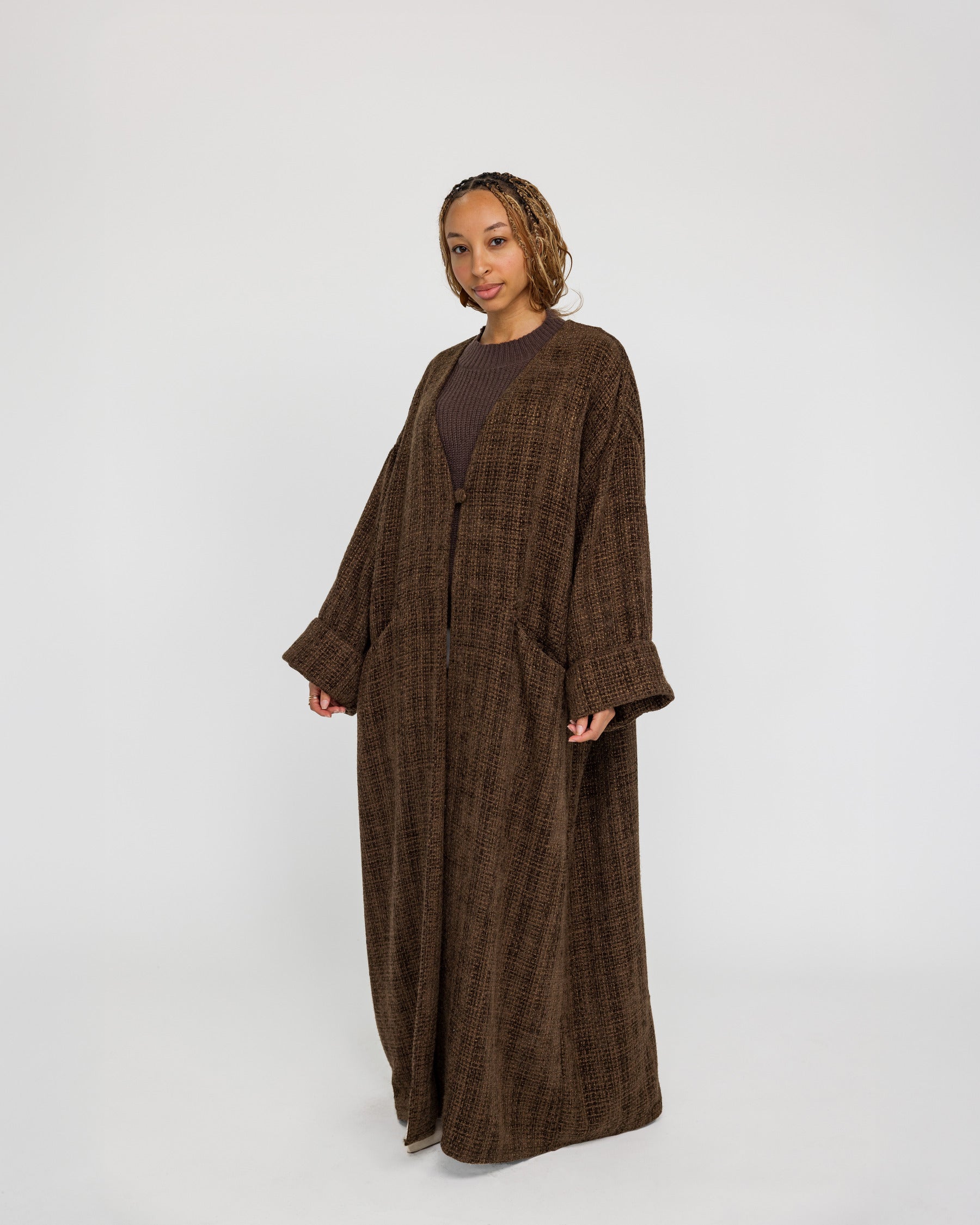 Oversized tweed abaya with textured fabric and a softly structured drape