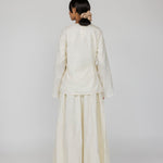 VELA tie front top in cream with a subtle woven texture and elegant drape.